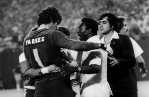 Parkes is congratulated by Pele after facing him in America. 